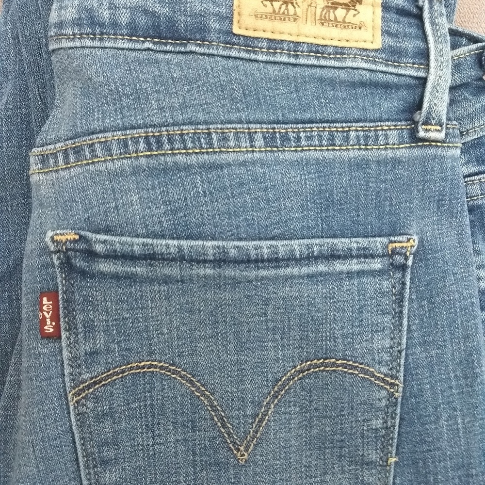 Levi Strauss Mid Rise Skinny Light Wash Jeans.